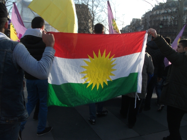 The flag of the Kurdish people, a people without a nation, a people without a land, to whom the promises of history ring hollow today more than they ever have. (C) Bernard J. Henry/AWC