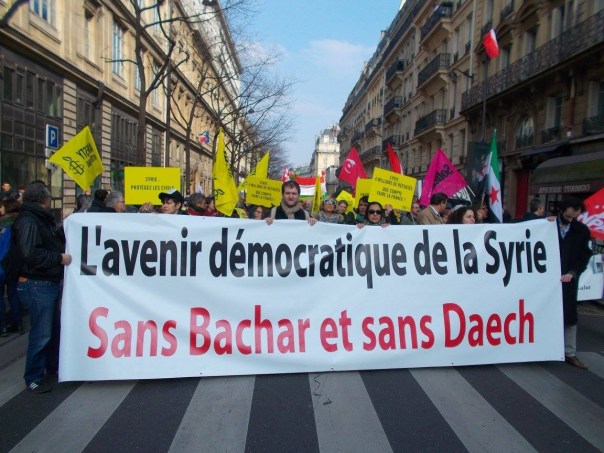 Syrian demonstrators in Paris, France, vowing for "a democratic future" in Syria "without [Syrian President] Bashar [al-Assad] and without Daesh [ISIS]". (C) AWC/Bernard J. Henry