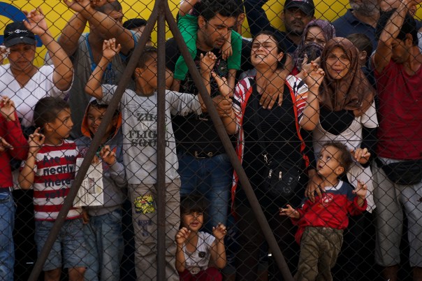 Women_and_children_among_Syrian_refugees_striking_at_the_platform_of_Budapest_Keleti_railway_station._Refugee_crisis._Budapest,_Hungary,_Cent